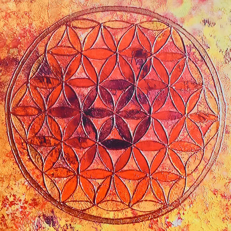 Fleur de vie gravée aux tons orangés, symbole d'harmonie intérieure